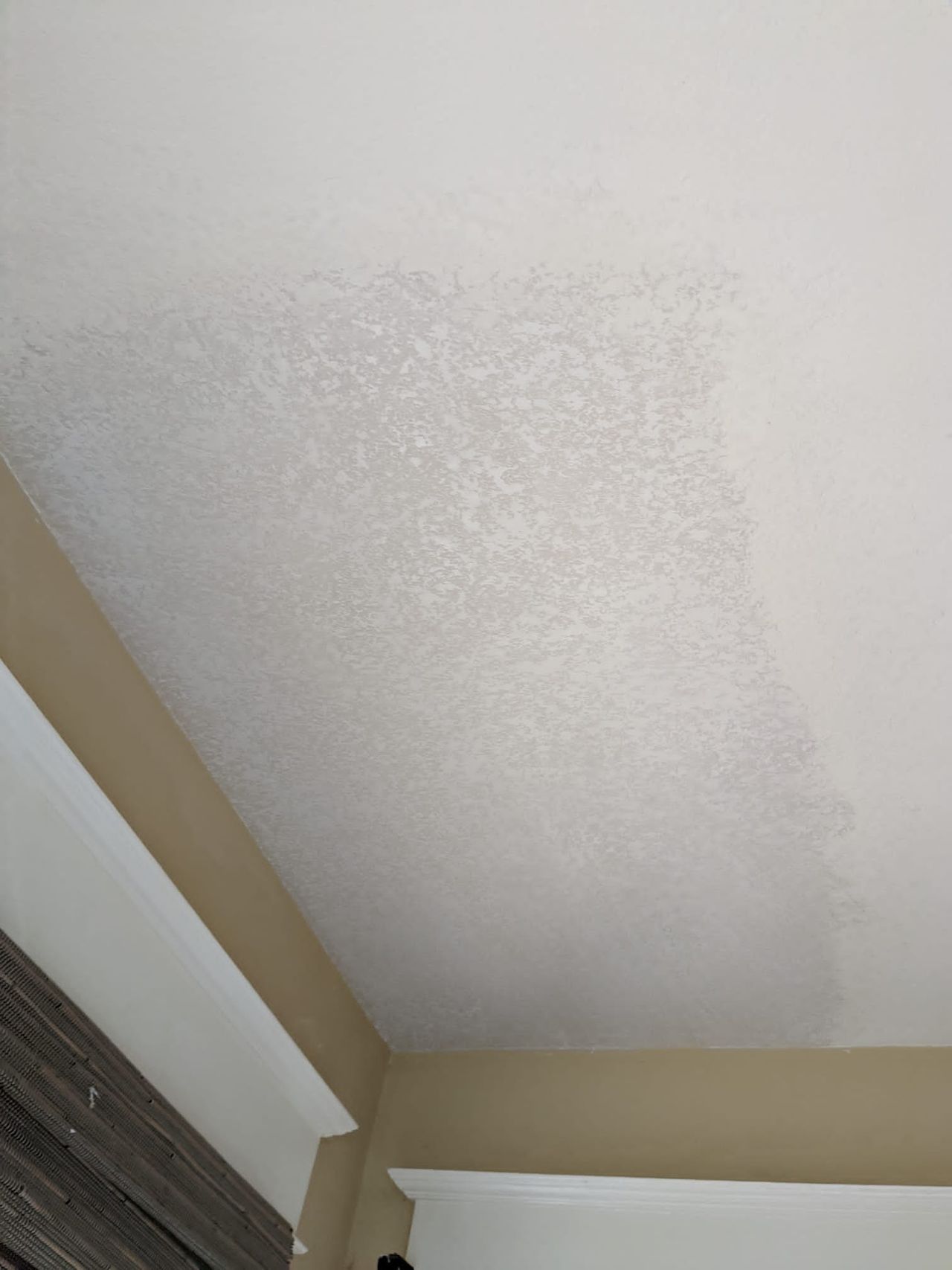 The same ceiling patched and textured to match