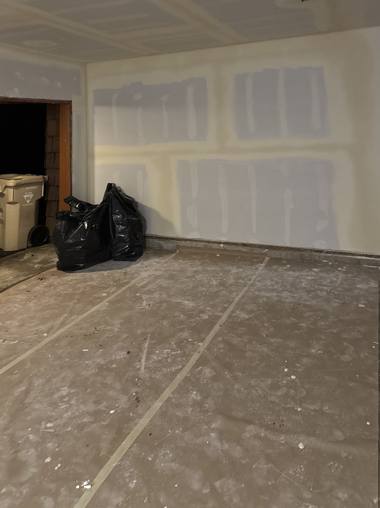 Garage walls and ceiling hung, taped, and coated