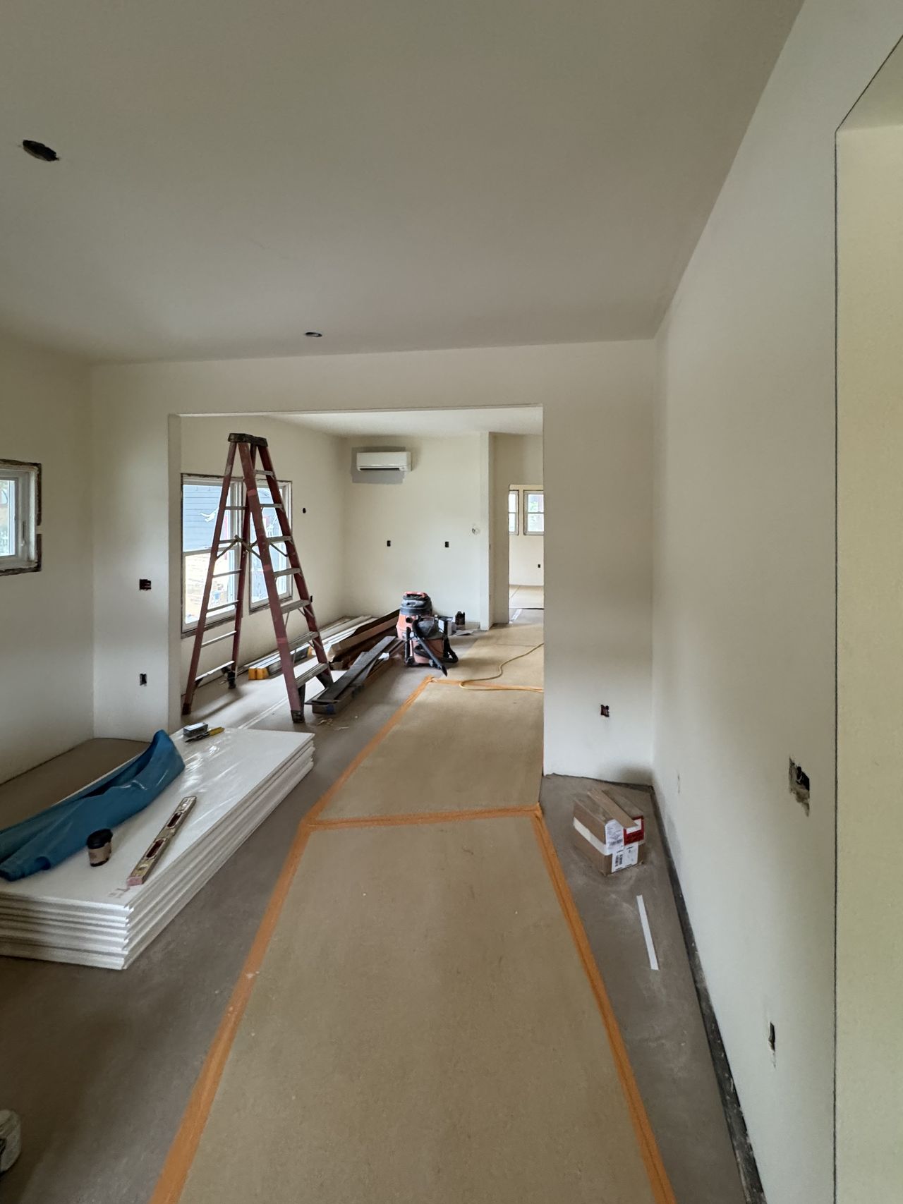 Hallway in the same house with walls and ceiling hung and finished