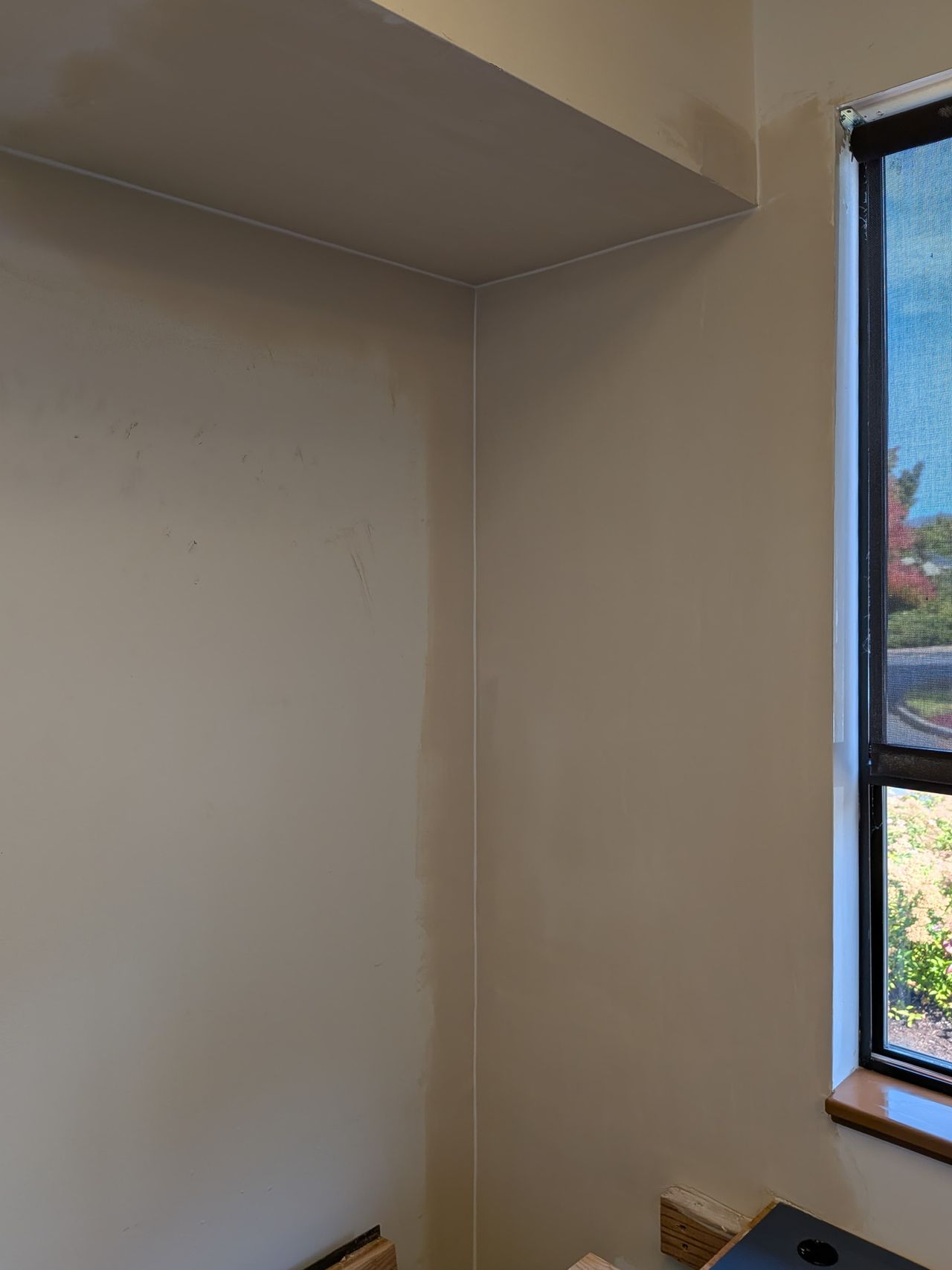 The same wall and soffit hung, taped, and finished